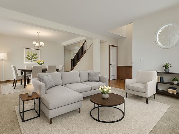 Enjoy a bright and inviting formal living and dining space, perfect for everyday comfort and effortless entertaining. (Virtually Staged)