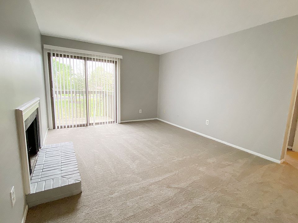 LIVING ROOM REFLECTING SLIDING GLASS DOOR TO BALCONY