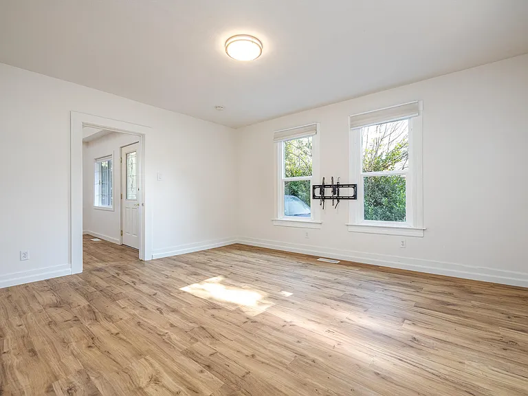 Den/Living room - was used as a bedroom by previous owners. TV mount can be removed if requested.