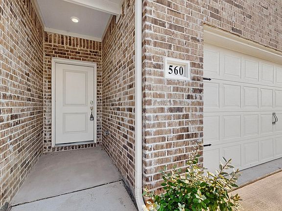 Front entry Door and 2 car garage.