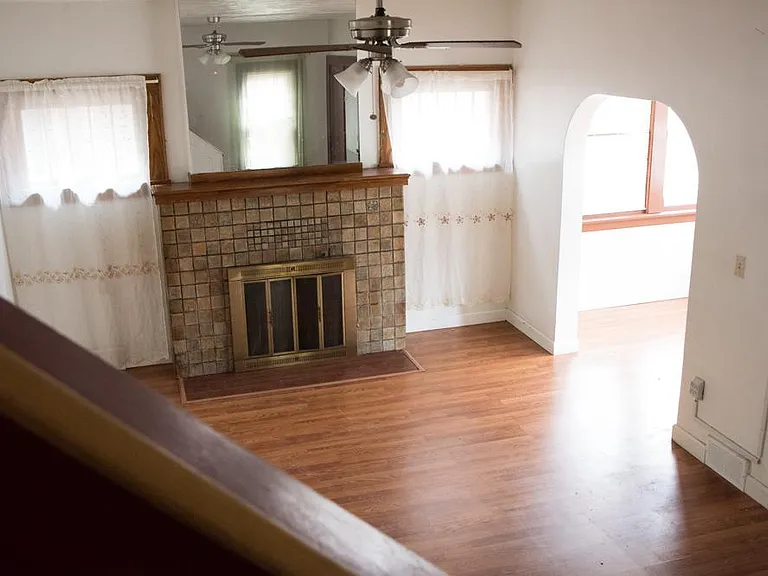 Living room with fireplace and sun room