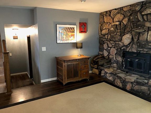 Woodburning fireplace that does an excellent job warming this home....perfect for its open floor plan