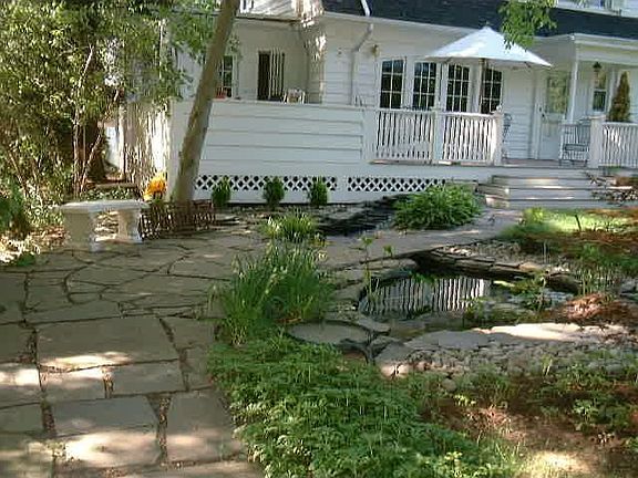 Approach from garage over pond.