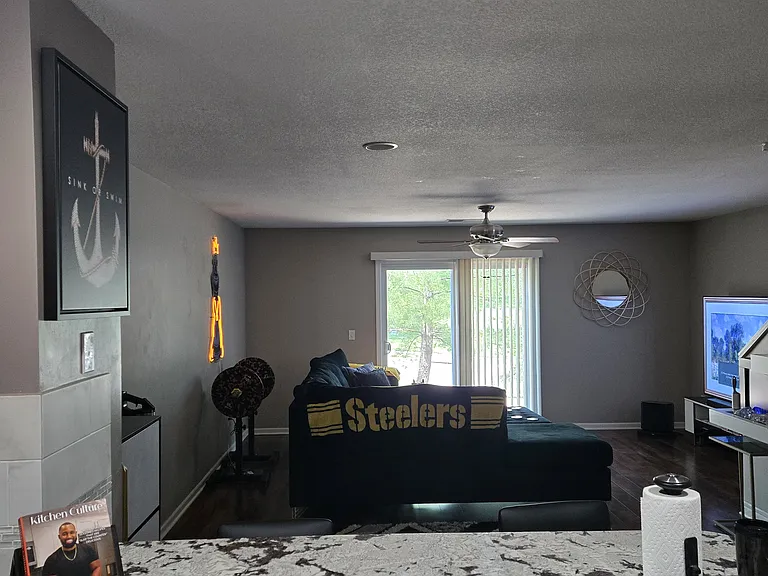 View of Living room/ dining area and patio doors with different set of furniture