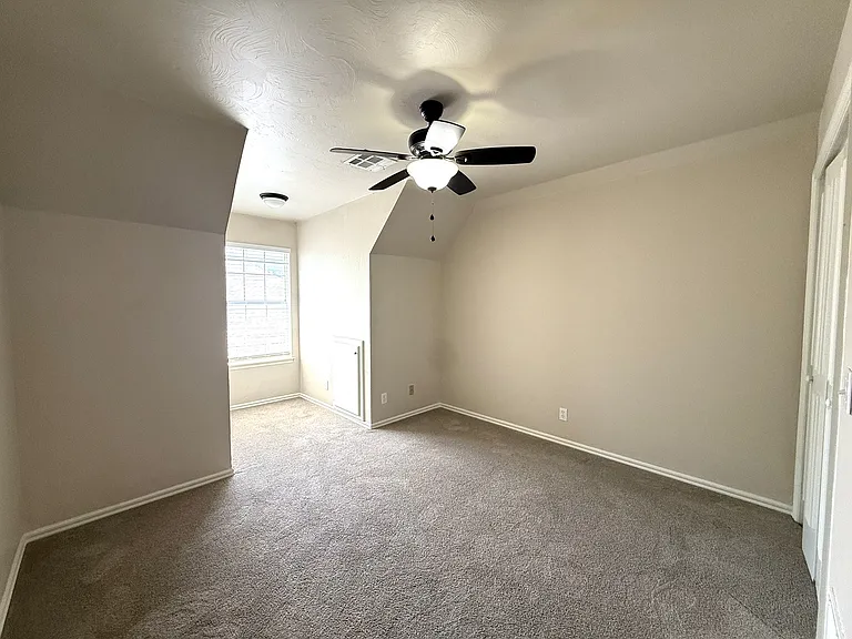 Upstairs room with lovely nook that lets the sunshine in. Great place for a playroom, bedrooms, study, man cave or workout room. So many options.