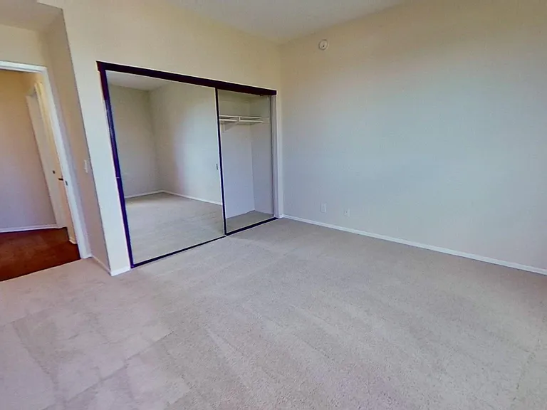 Primary bedroom of apartment #319