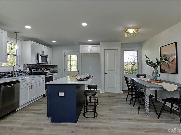Kitchen, dining area & back door(Pictured without refrigerator)