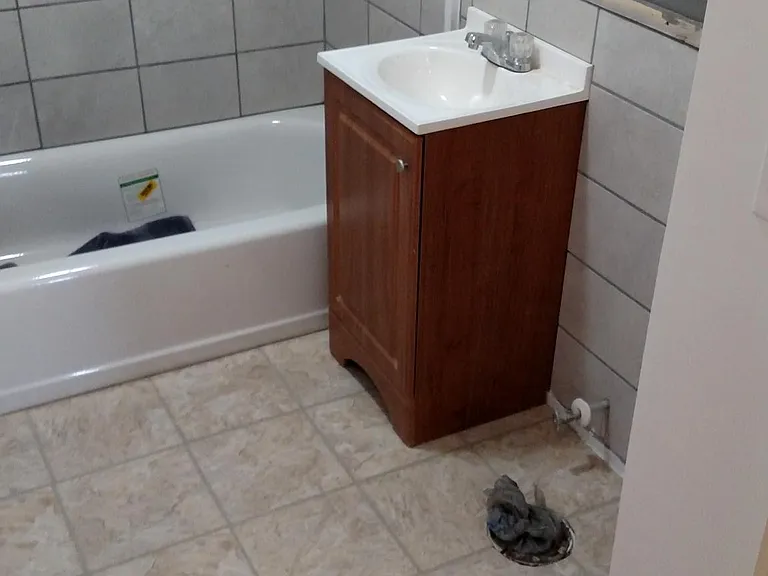 Bathroom being completely renovated. New walls, tile shower & walls, new floor, Sink. Full wall mirror being installed.