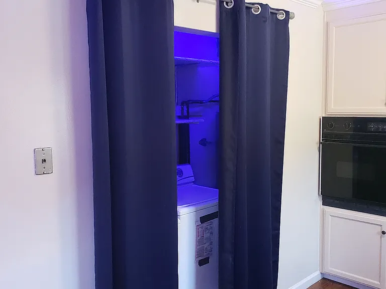 laundry area with LED lighting