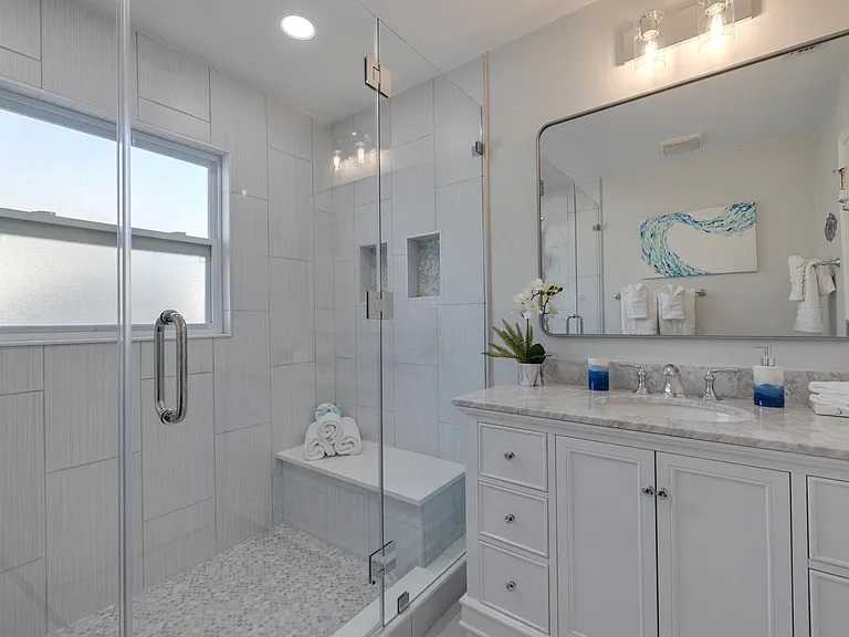 Recently updated guest bath with huge shower.