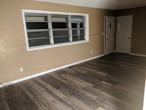 Large living room with coat closet just inside front door