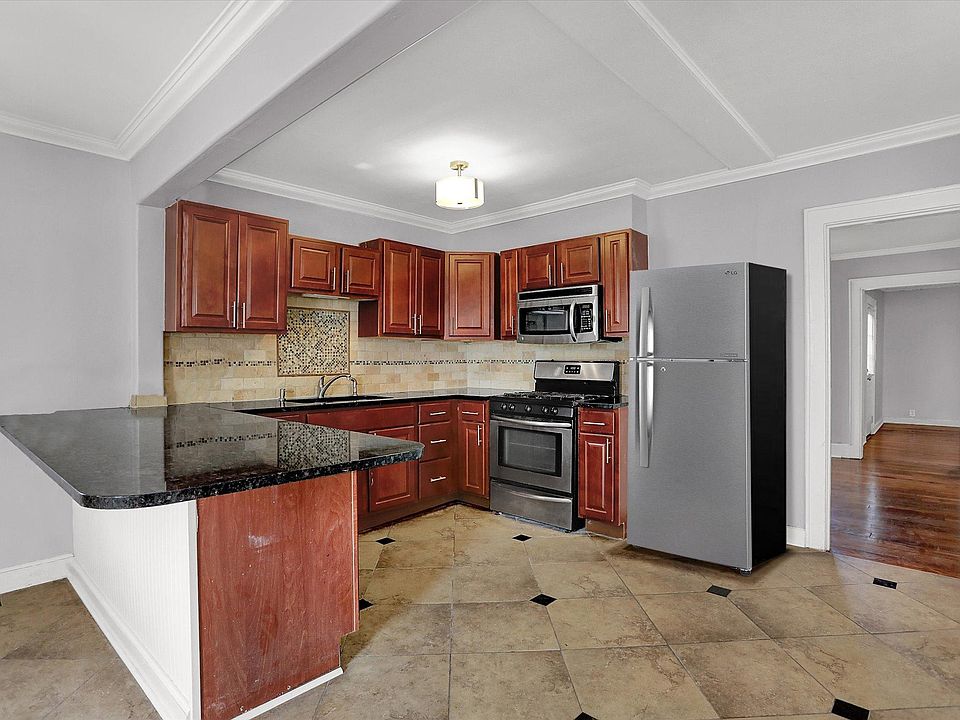 Large open design kitchen with stainless steel appliances