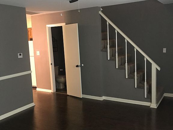 Living room, 1/2 bath, stairs to 2nd floor.
