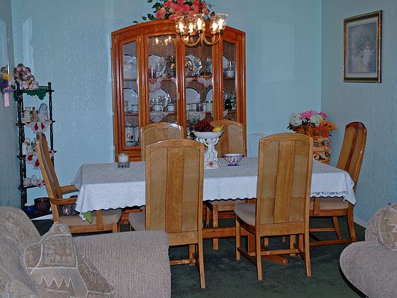 The spacious dining room is open to the formal living room.