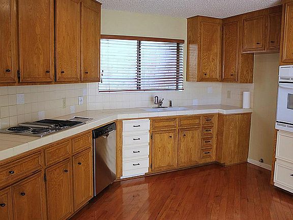 Beautiful wood flooring in this spacious Kitchen. Lots of cabinets