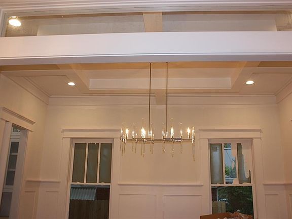 Dining room is highlighted, off the main foyer, by the transom above as well as custom trim and ceiling details.  You tell us wh