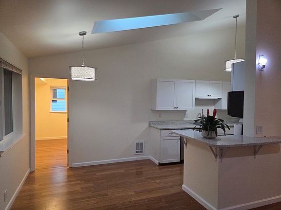 Dining Room and Kitchen with Skylight