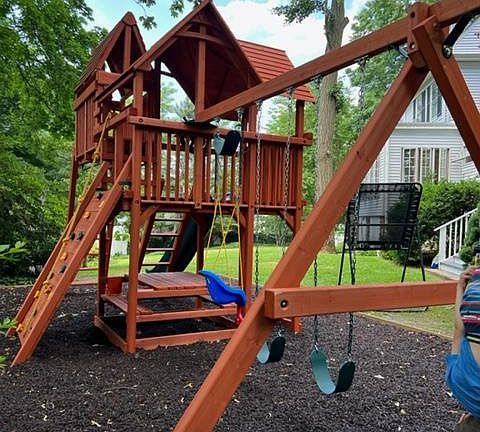 Brand new playground with monkey bars, climbing wall, sky box, baby swing and rubber mulch for safety.