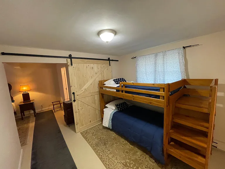 Bunk Room with the Barn Door completely open to the Main Bedroom