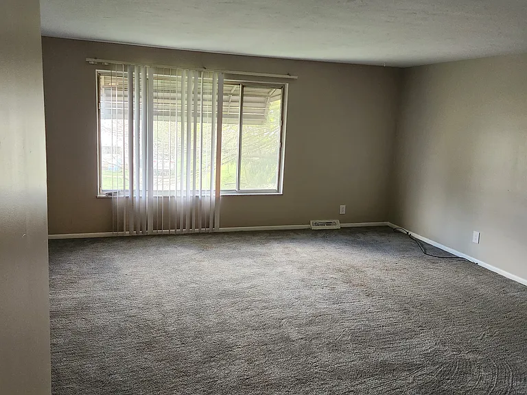 Living room. New paint throughout, modern accessible beige by Sherwin Williams!