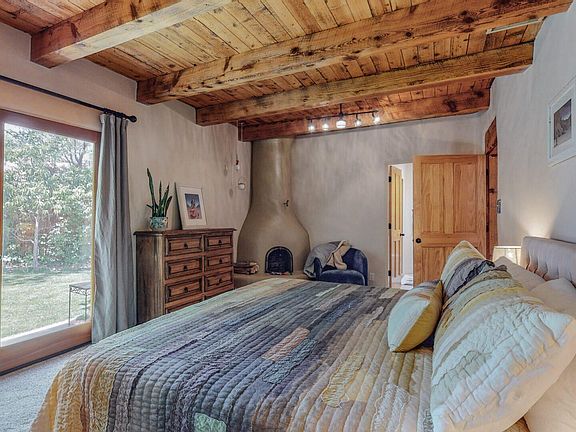 Master bedroom and gas kiva fireplace