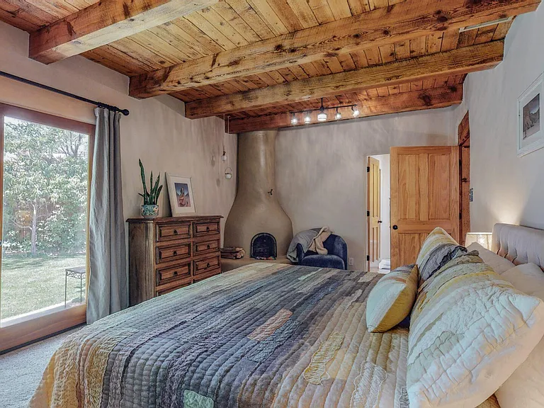 Master bedroom and gas kiva fireplace