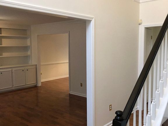 View into the sitting room, or office with a peek of the dining room that is off of the kitchen.