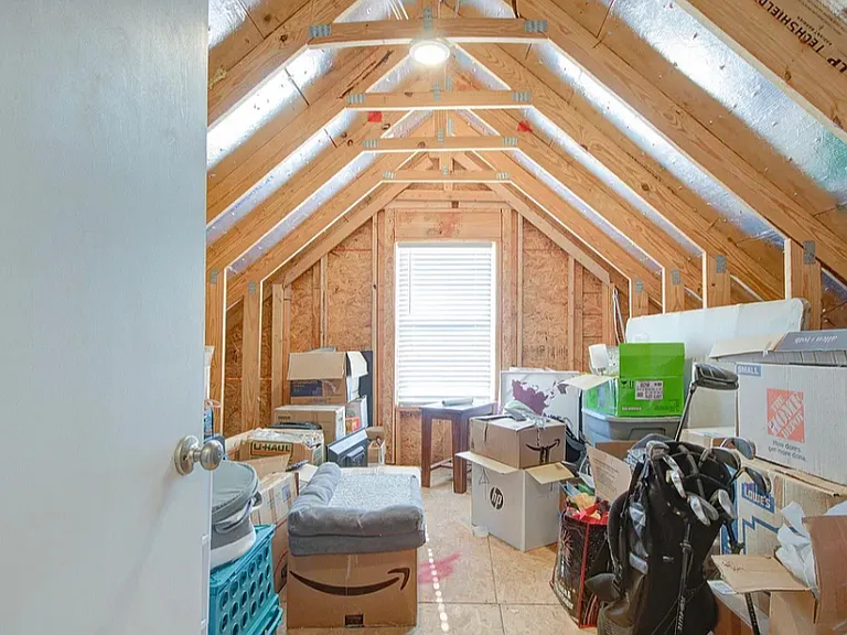 Walk in attic space above garage