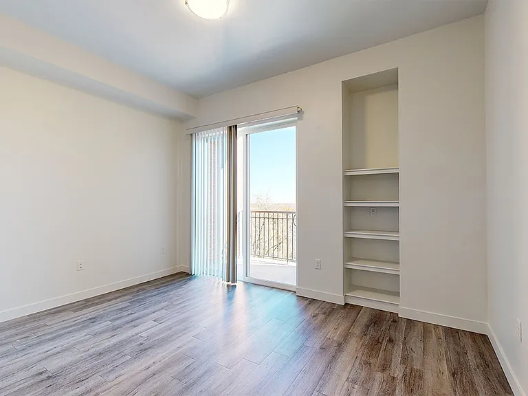 Apartment living room with wood-style flooring.
