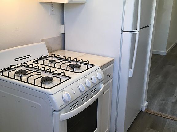 brand new stove and hood fan. Refrigerator is 2 years old.