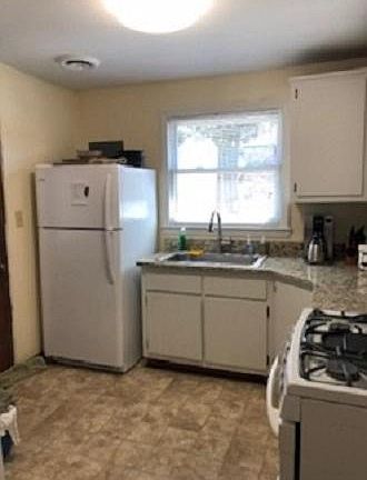 remodeled kitchen with like new refrigerator