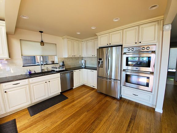 Gourmet Kitchen with Stainless Steel Appliances, Granite Counter Tops, and Thomasville Cabinetry.