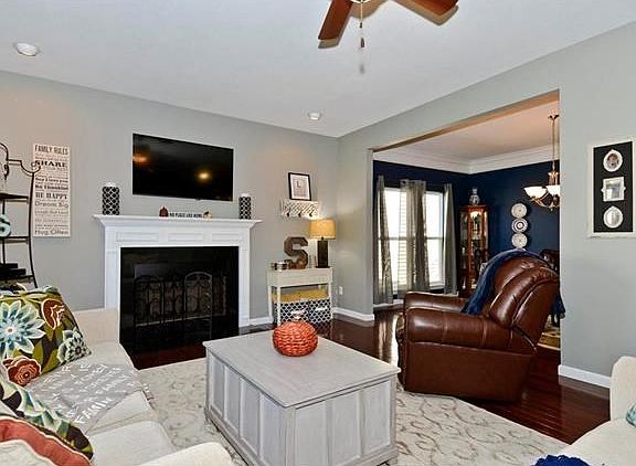 Living room with a wood burning fireplace to cozy up to.