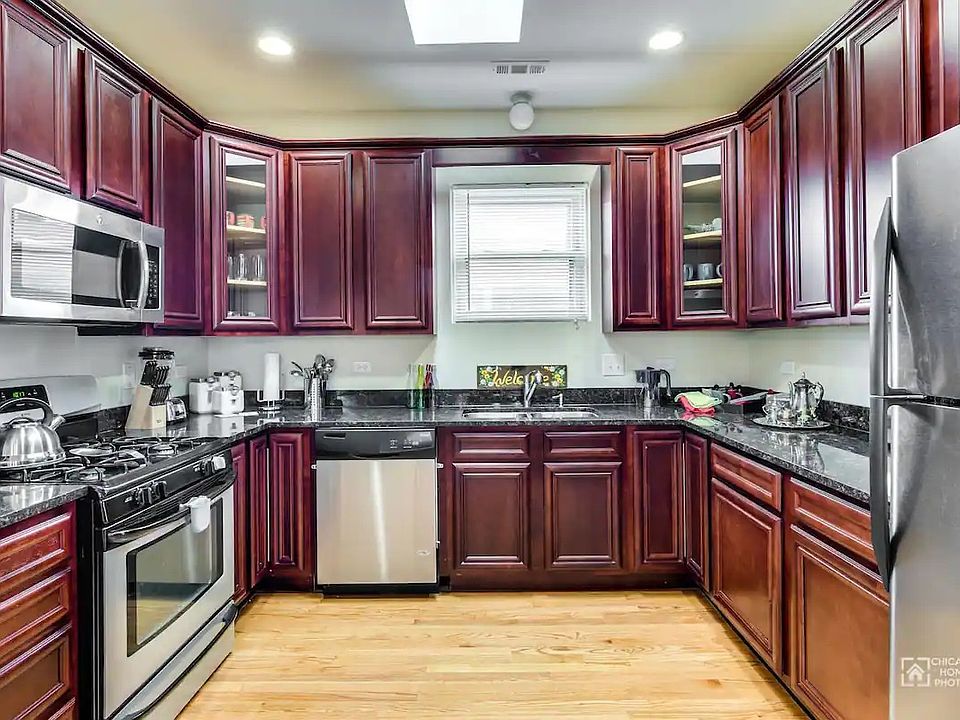 Fully Stocked Kitchen with plates, silveware, pots and pans, rice cooker, etc.