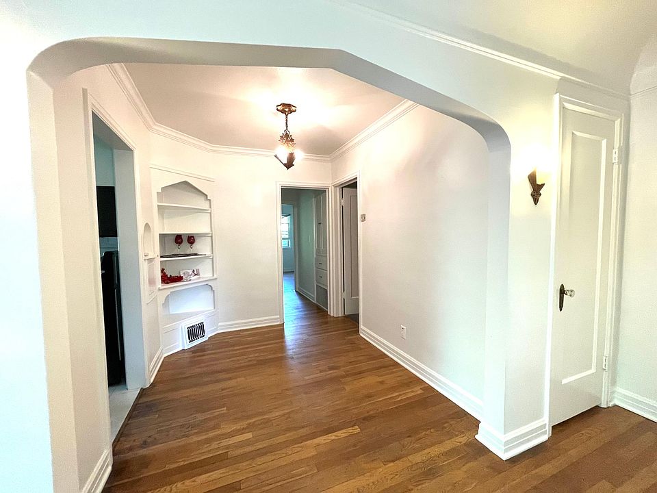 Dining Room with 1930s period light fixture and built in china hutch