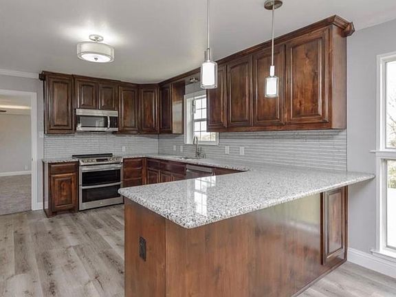 Microwave, range with double oven, granite countertops all new