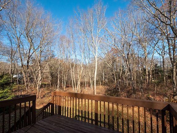 Oversize deck with gorgeous views of the lightly wooded 0.96 acre lot.