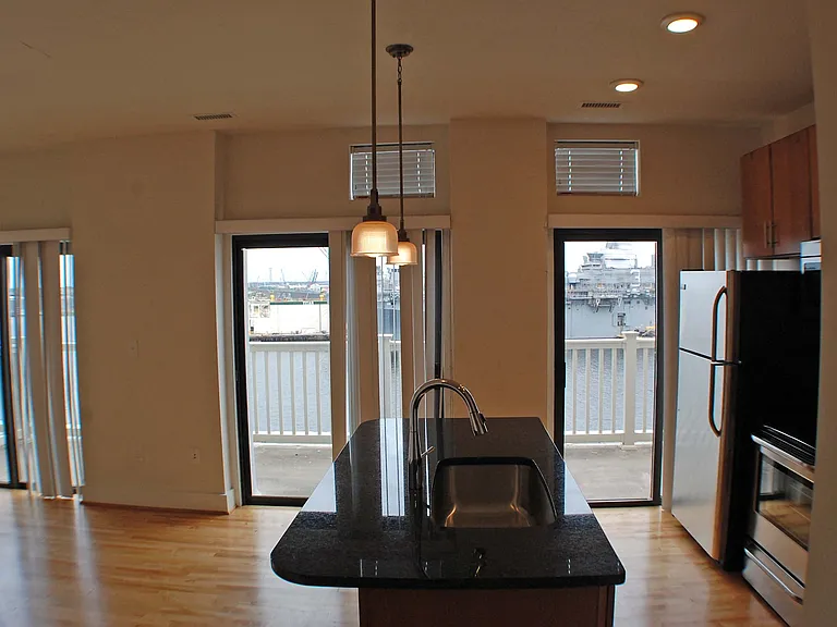 This kitchen and Living room lead out onto a spacious balcony overlooking the Elizabeth River