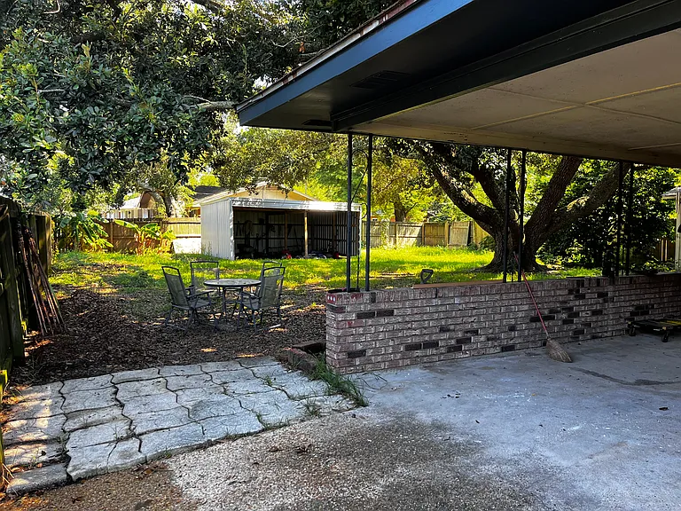 Fenced backyard with 2 bay pole bard, 2 double gates for access