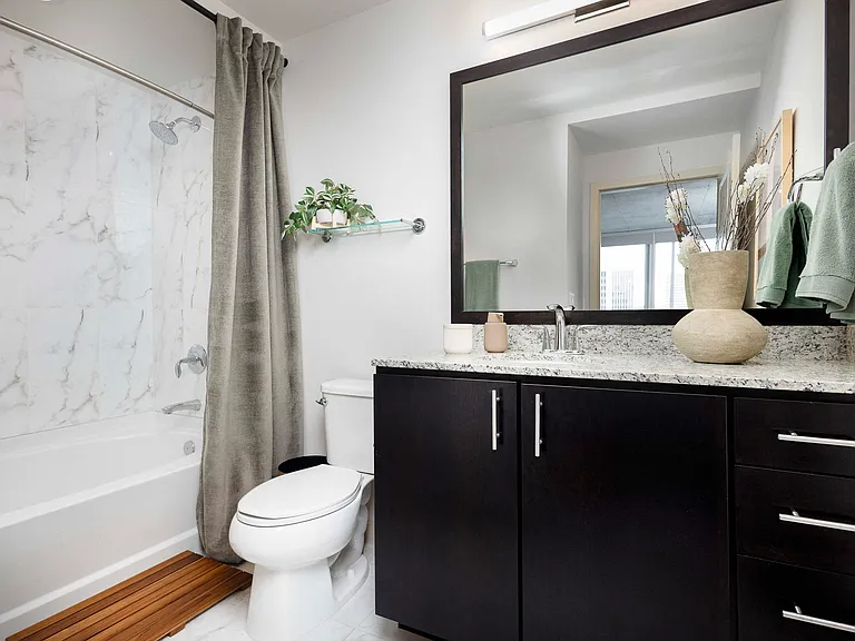 Spa-styled baths with Cararra marble-look floors