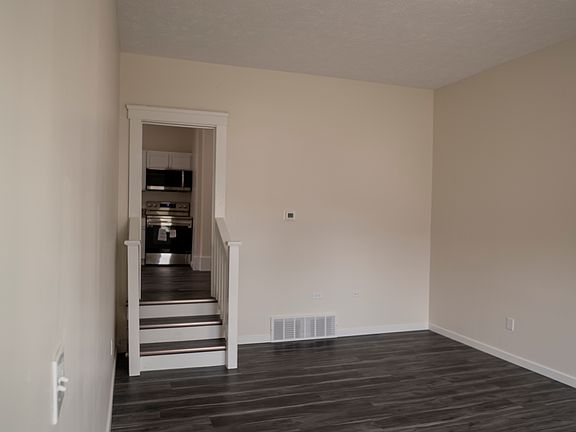 Living area - stairs lead up to kitchen