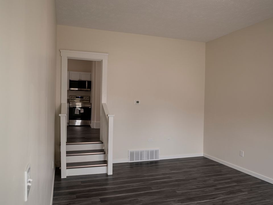 Living area - stairs lead up to kitchen