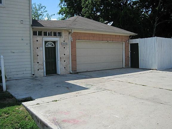 side of the house with extra parking