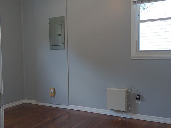Bedroom 1 with original hardwood floors and double closets