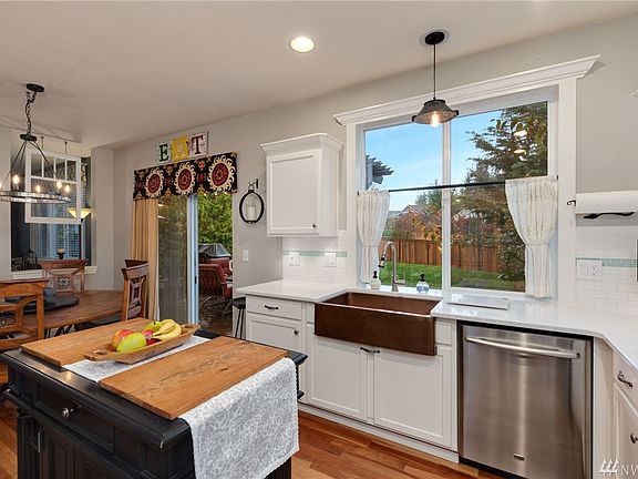 Quartz counters, bright window overlooking back yard.
