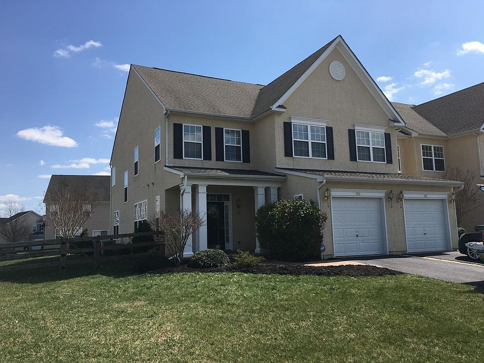 End unit with side and back yard.