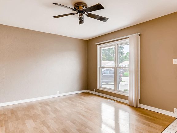 Living Room with laminate flooring has been freshly painted.