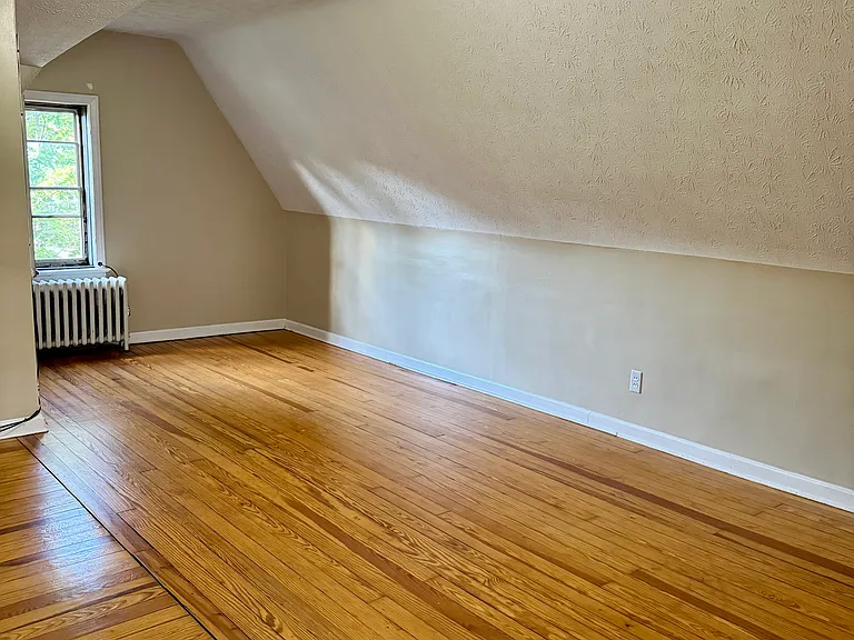 Spacious third-floor family room ideal for a playroom, media room, hobby space, guest area, or additional flex living space.