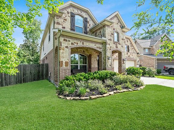 Beautifully Landscaped with Brick and Stone Exterior.
