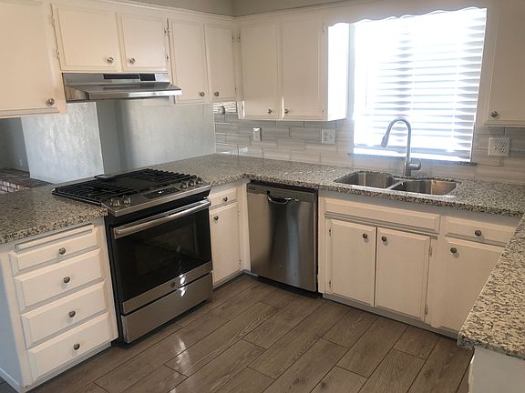 Kitchen has ss stove and hood, dishwasher and double sink. No refrigerator.